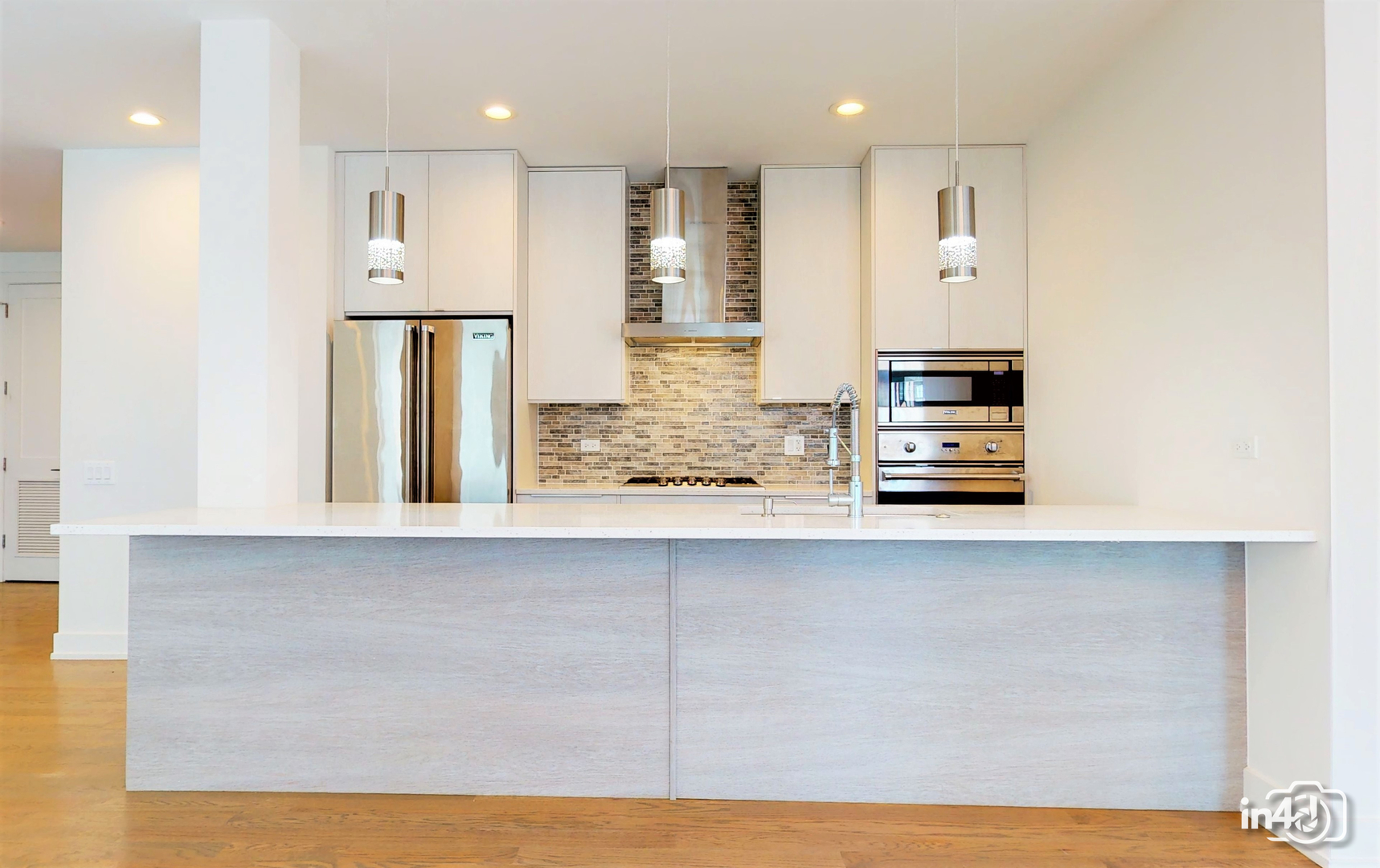 236 South Racine Avenue, Unit 201 Chicago, IL 60607 - Photo 15 of 45 a kitchen with stainless steel appliances a refrigerator and wooden cabinets