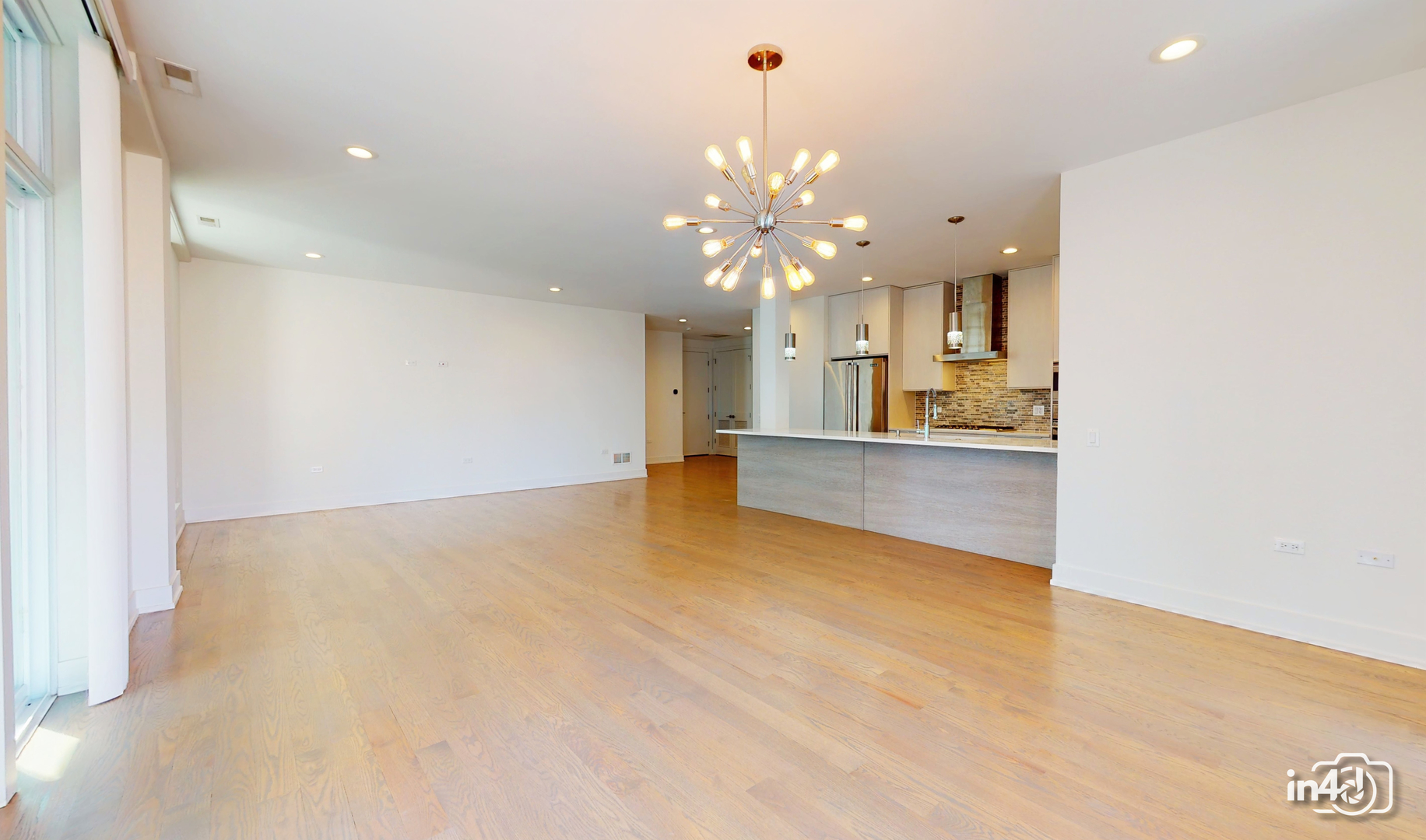 236 South Racine Avenue, Unit 201 Chicago, IL 60607 - Photo 19 of 45 a view of a kitchen with a sink and a chandelier