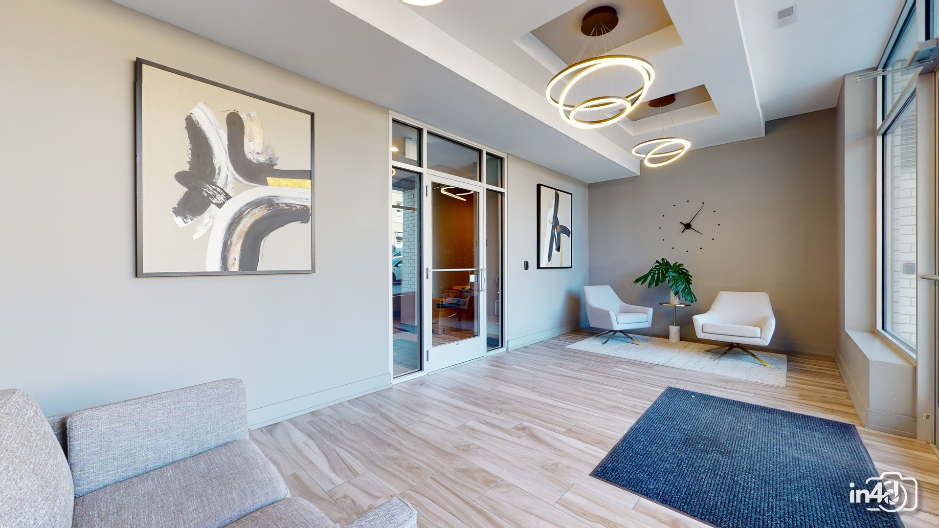 236 South Racine Avenue, Unit 201 Chicago, IL 60607 - Photo 23 of 45 a bedroom with a large bed and a chandelier