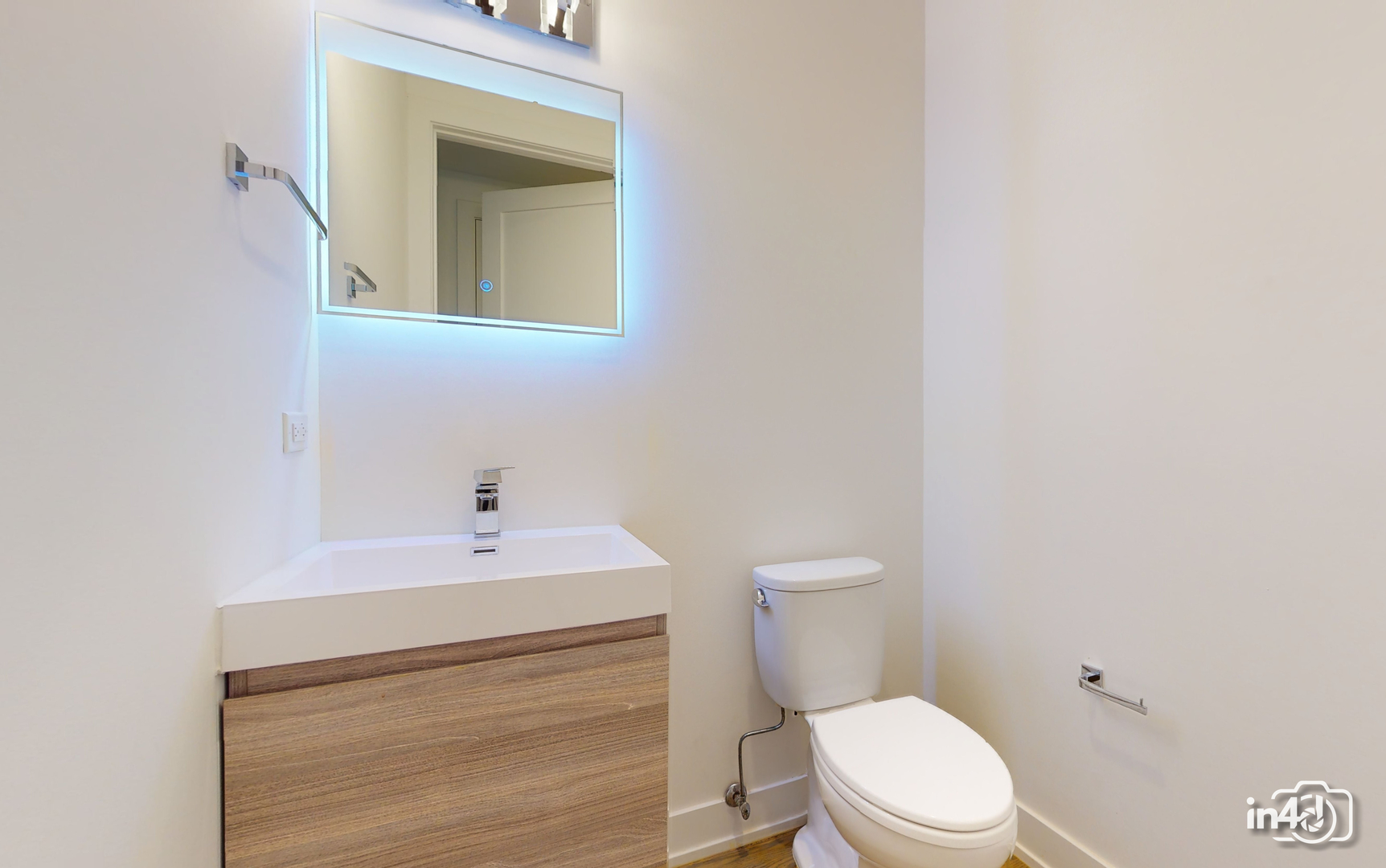 236 South Racine Avenue, Unit 201 Chicago, IL 60607 - Photo 25 of 45 a bathroom with a sink a toilet and mirror