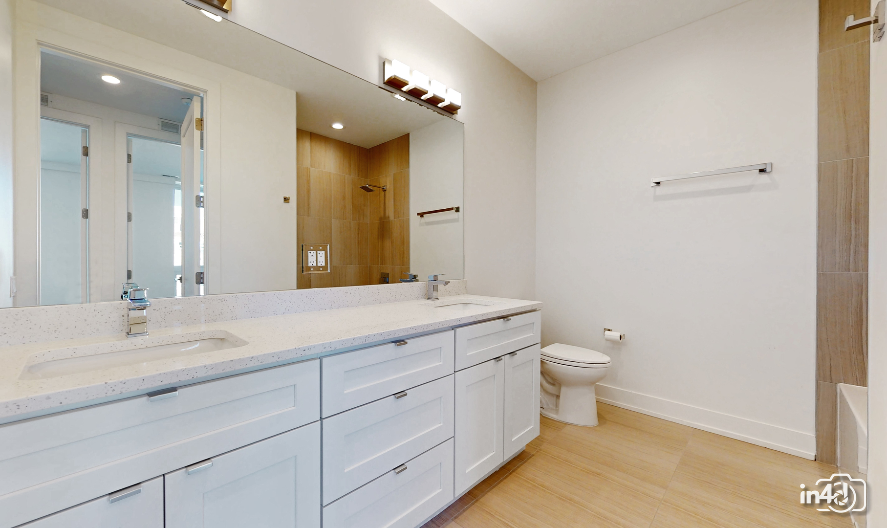 236 South Racine Avenue, Unit 201 Chicago, IL 60607 - Photo 29 of 45 a bathroom with a granite countertop sink mirror and toilet