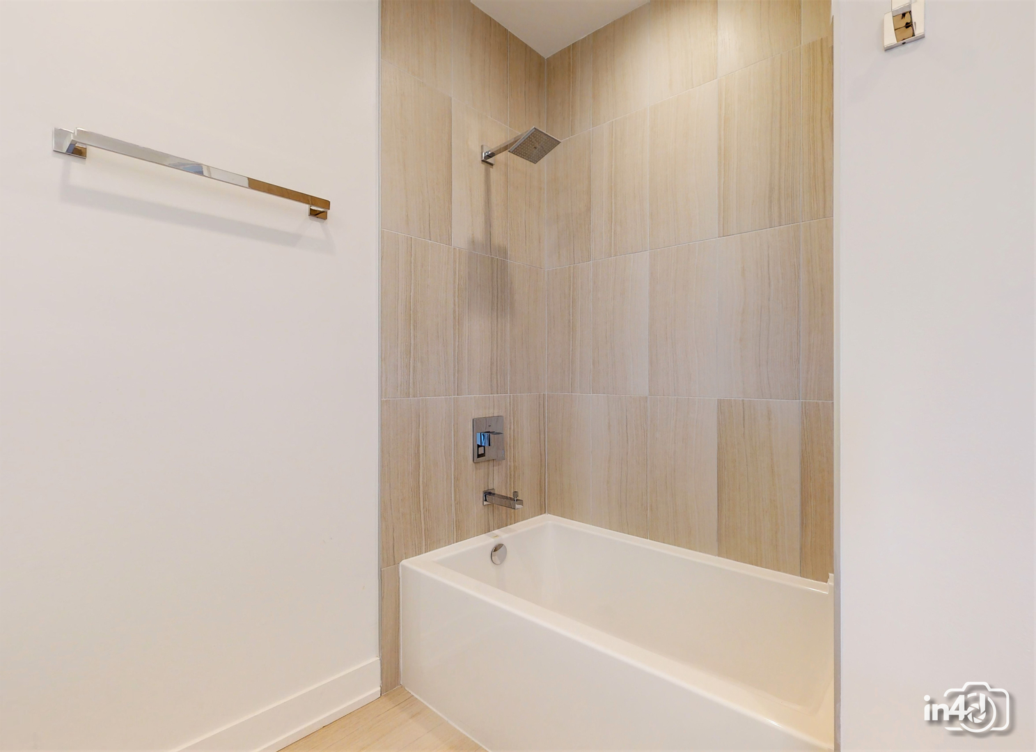 236 South Racine Avenue, Unit 201 Chicago, IL 60607 - Photo 32 of 45 a bathroom with a white bath tub