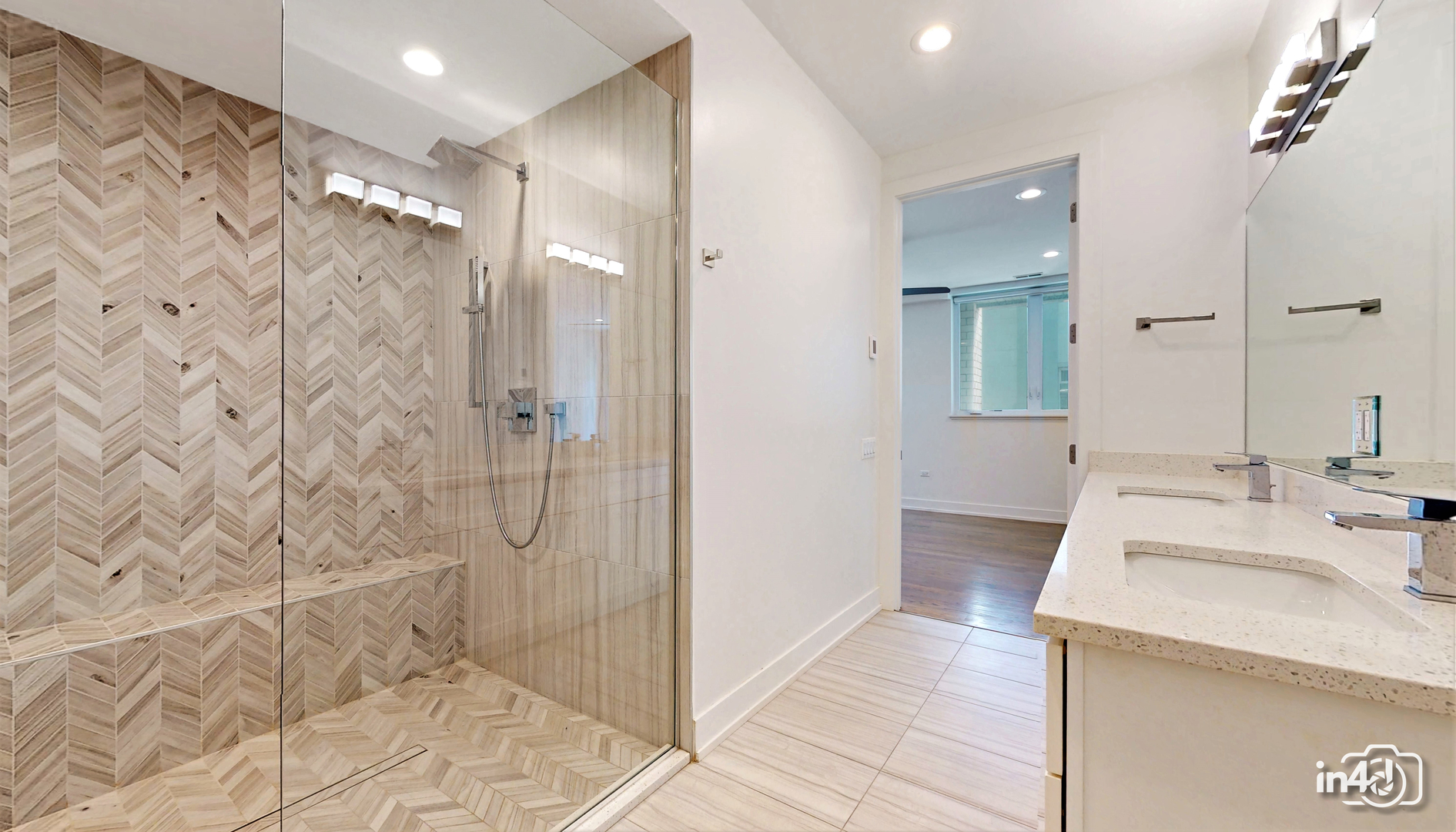 236 South Racine Avenue, Unit 201 Chicago, IL 60607 - Photo 41 of 45 a bathroom with a sink and a mirror