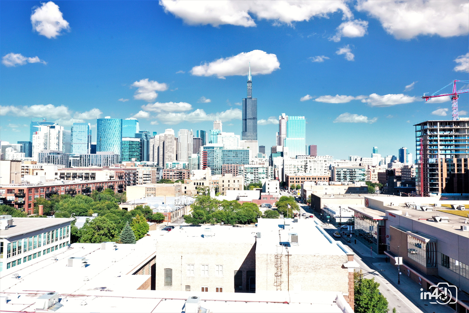 236 South Racine Avenue, Unit 201 Chicago, IL 60607 - Photo 6 of 45 a large kitchen with lots of counter space and chandelier