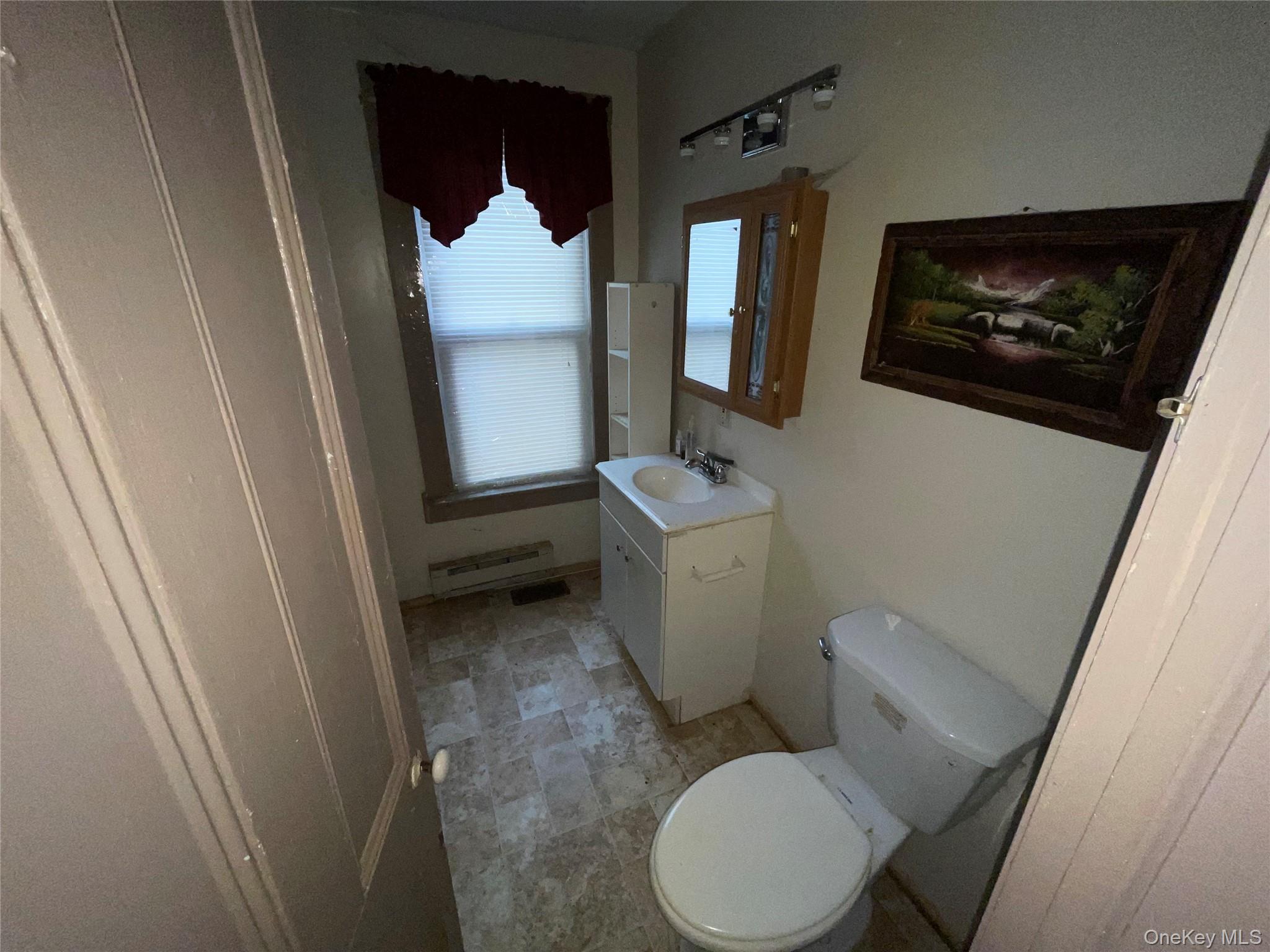 865 North Branch Road Callicoon, NY 12766 - Photo 6 of 15 Bathroom featuring vanity and baseboard heating