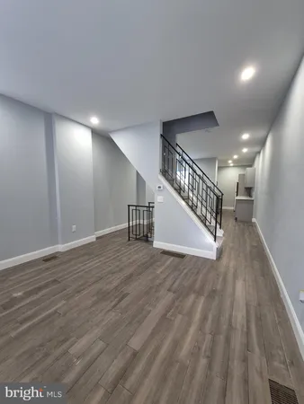 a view of entryway with wooden floor