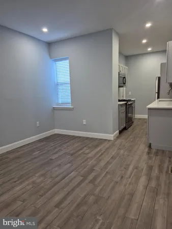 a view of a kitchen with a sink and a window