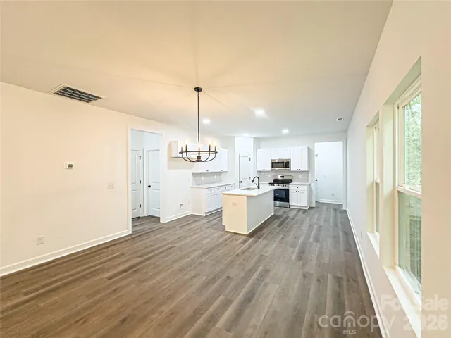 a view of kitchen with wooden floor