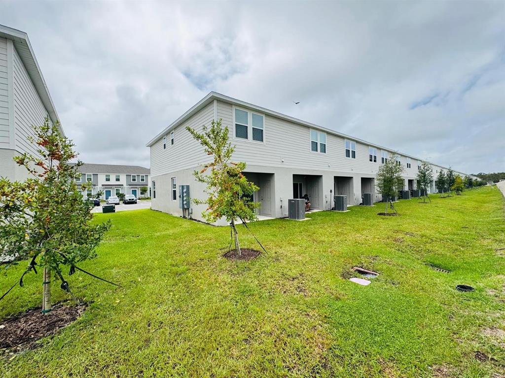 3140 Skyline Loop Kissimmee, FL 34758 - Photo 26 of 27 a house view with a garden space