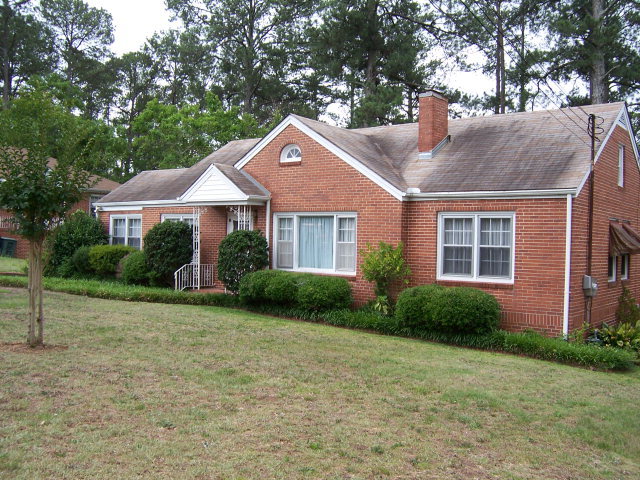 1746 Upper River Road, Unit 100 Macon, GA 31211 - Photo 1 of 1 a front view of a house with garden