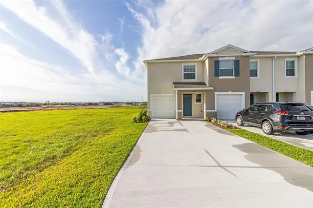 a view of swimming pool with outdoor seating and yard in back