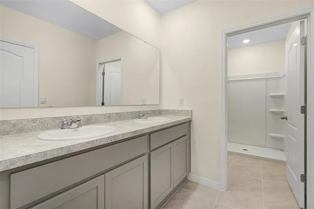 a bathroom with a granite countertop sink mirror and a