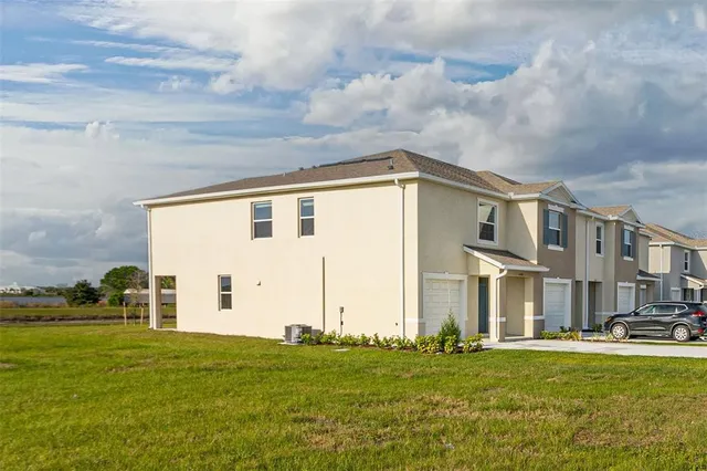 a front view of building with yard
