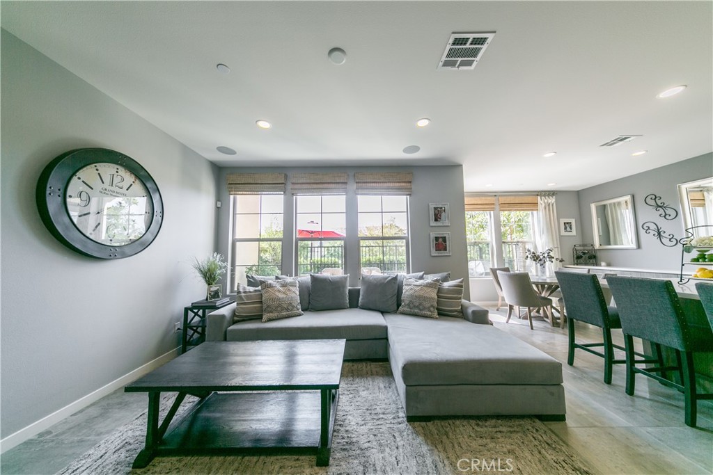 308 Finch Lake Forest, CA 92630 - Photo 1 of 35 a living room with furniture a clock and a window
