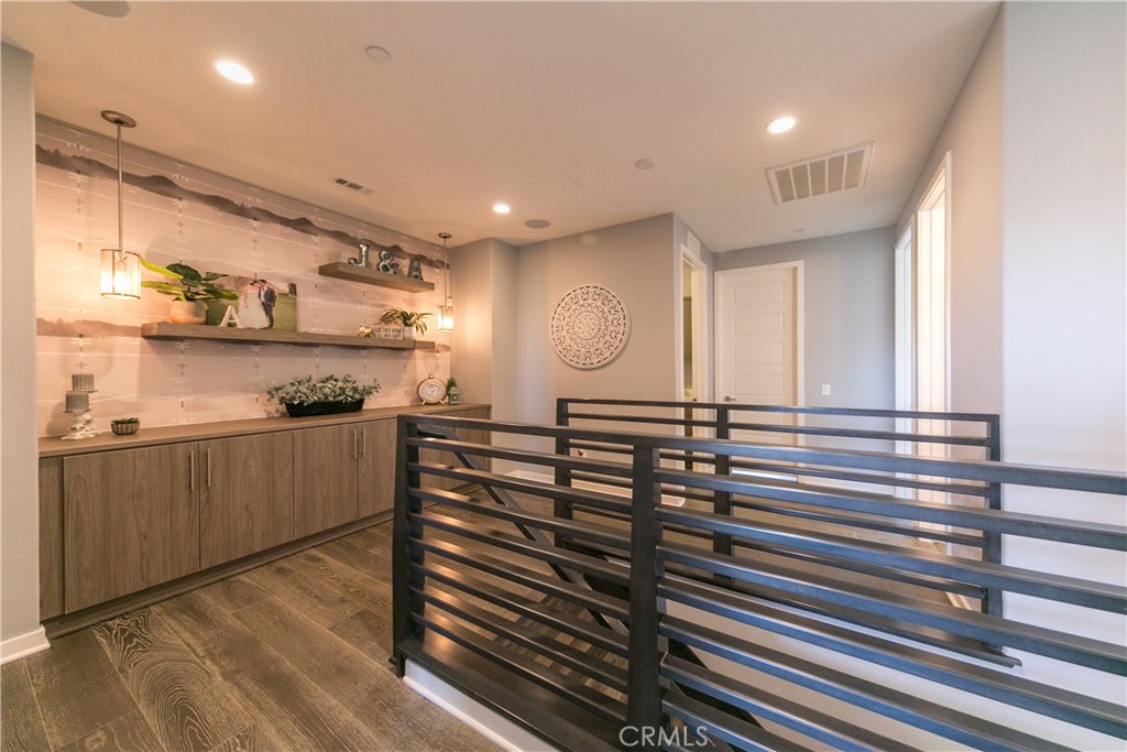 308 Finch Lake Forest, CA 92630 - Photo 12 of 35 a kitchen with lots of counter space and wooden floor