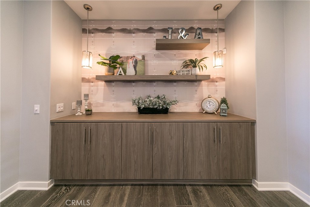 308 Finch Lake Forest, CA 92630 - Photo 13 of 35 a kitchen with a wooden floor and cabinets