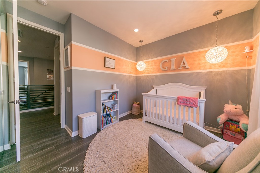 308 Finch Lake Forest, CA 92630 - Photo 19 of 35 a bedroom with furniture and a wooden floor