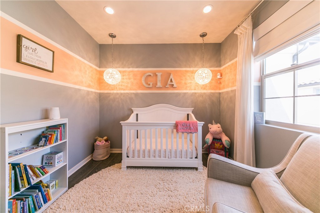 308 Finch Lake Forest, CA 92630 - Photo 20 of 35 a bedroom with a bed and a book shelf