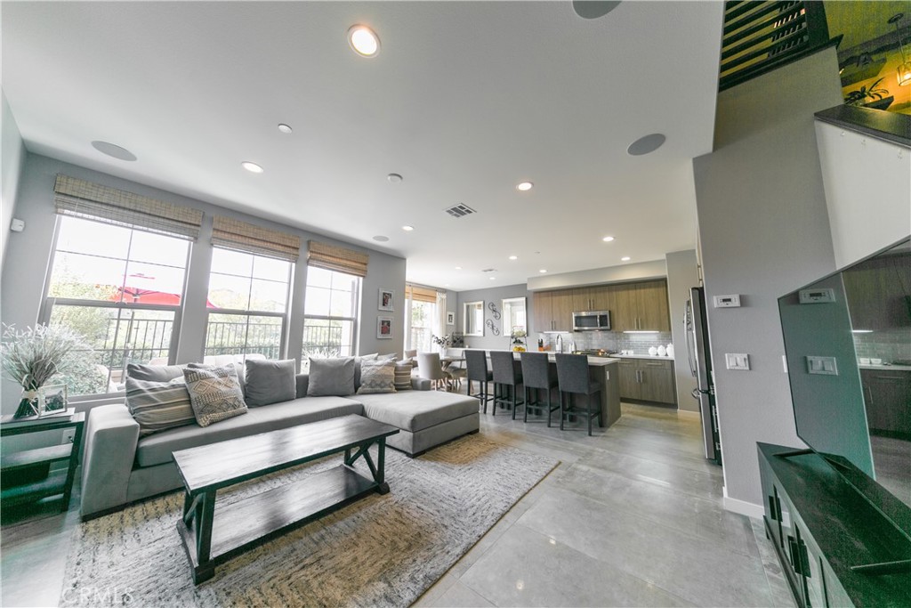 308 Finch Lake Forest, CA 92630 - Photo 3 of 35 a living room with furniture a rug and a flat screen tv