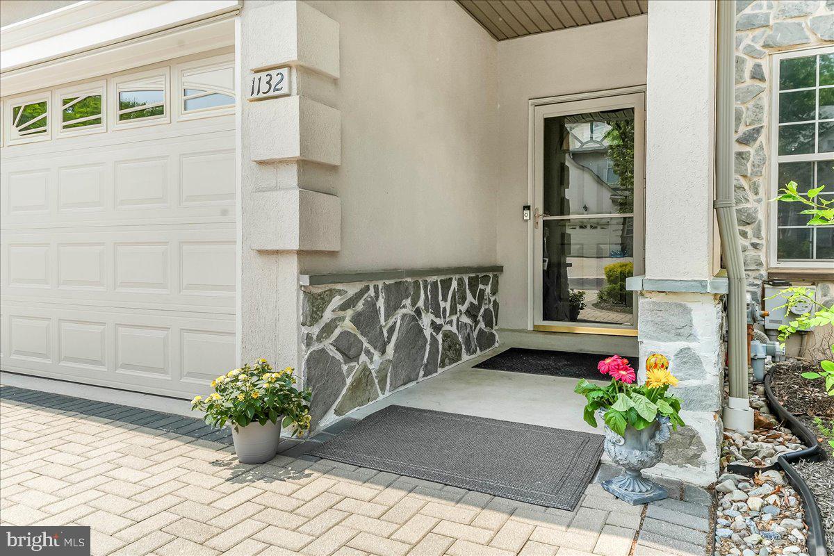 1132 Brian's Way Wayne, PA 19087 - Photo 2 of 45 a view of front door of house with potted plant