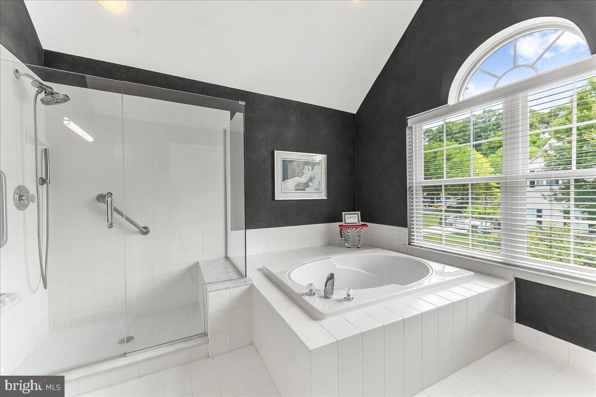 1132 Brian's Way Wayne, PA 19087 - Photo 26 of 45 a bathroom with a tub a window and a shower