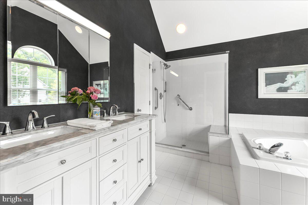 1132 Brian's Way Wayne, PA 19087 - Photo 28 of 45 a bathroom with a granite countertop sink mirror and bathtub