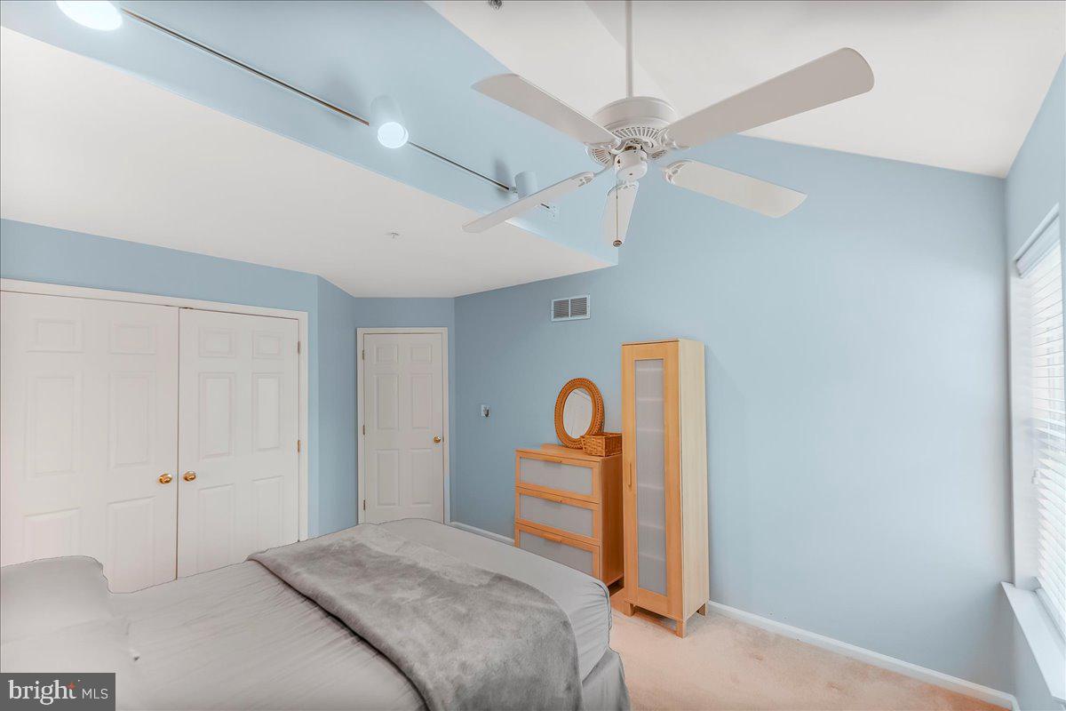 1132 Brian's Way Wayne, PA 19087 - Photo 31 of 45 a bedroom with a bed and a chandelier