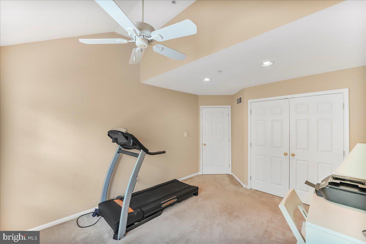 1132 Brian's Way Wayne, PA 19087 - Photo 33 of 45 a room with gym equipment and a ceiling fan