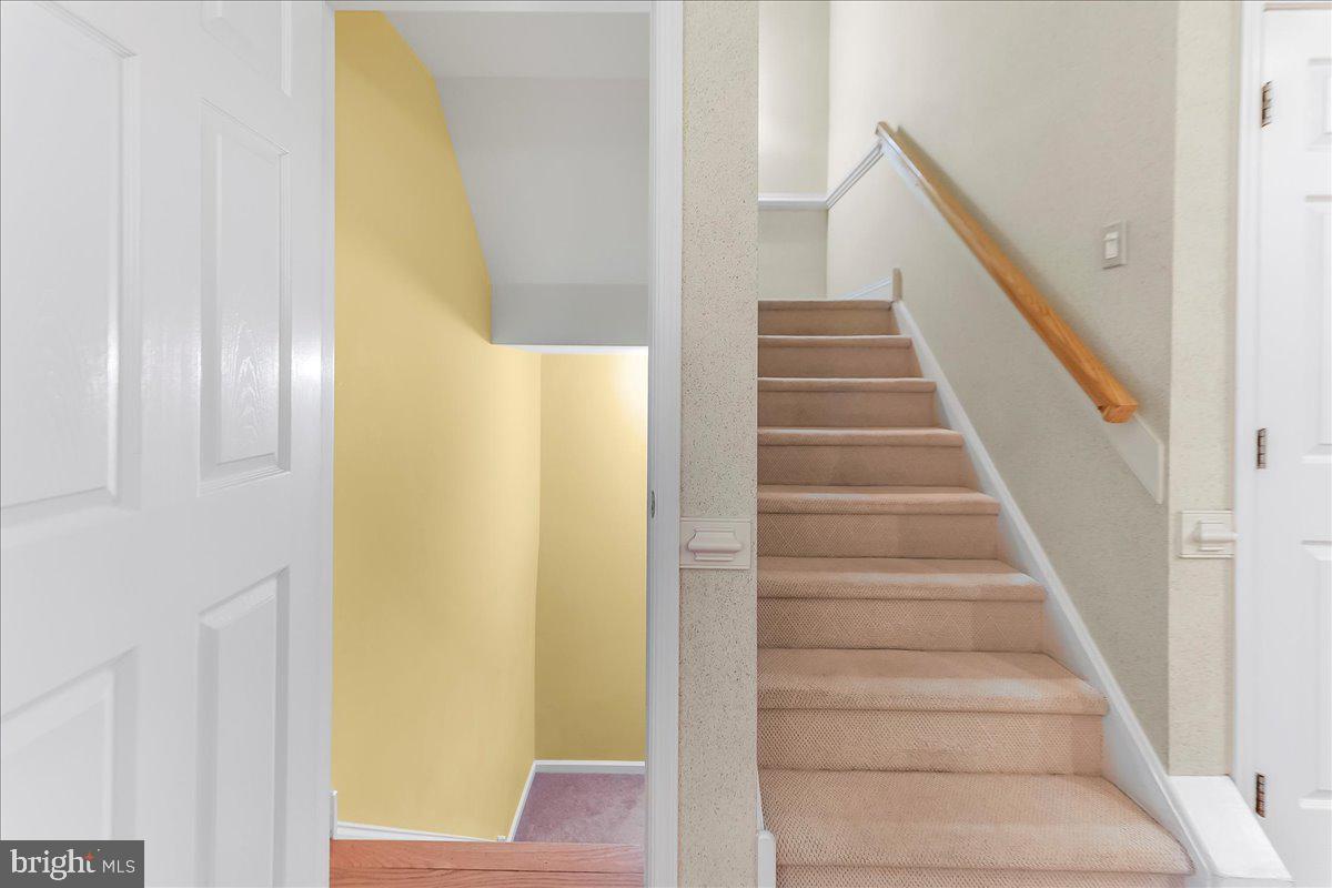 1132 Brian's Way Wayne, PA 19087 - Photo 36 of 45 a view of staircase with wooden floor and a potted plant