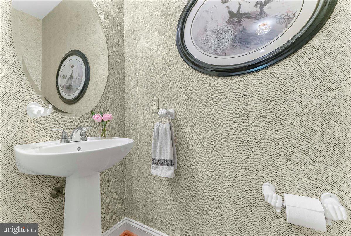 1132 Brian's Way Wayne, PA 19087 - Photo 4 of 45 a bathroom with a sink and a mirror