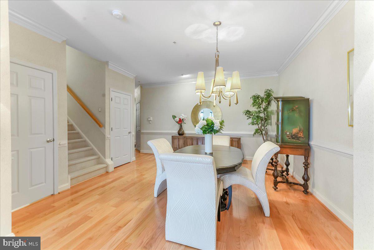 1132 Brian's Way Wayne, PA 19087 - Photo 6 of 45 a view of a dining room and livingroom with furniture wooden floor a chandelier