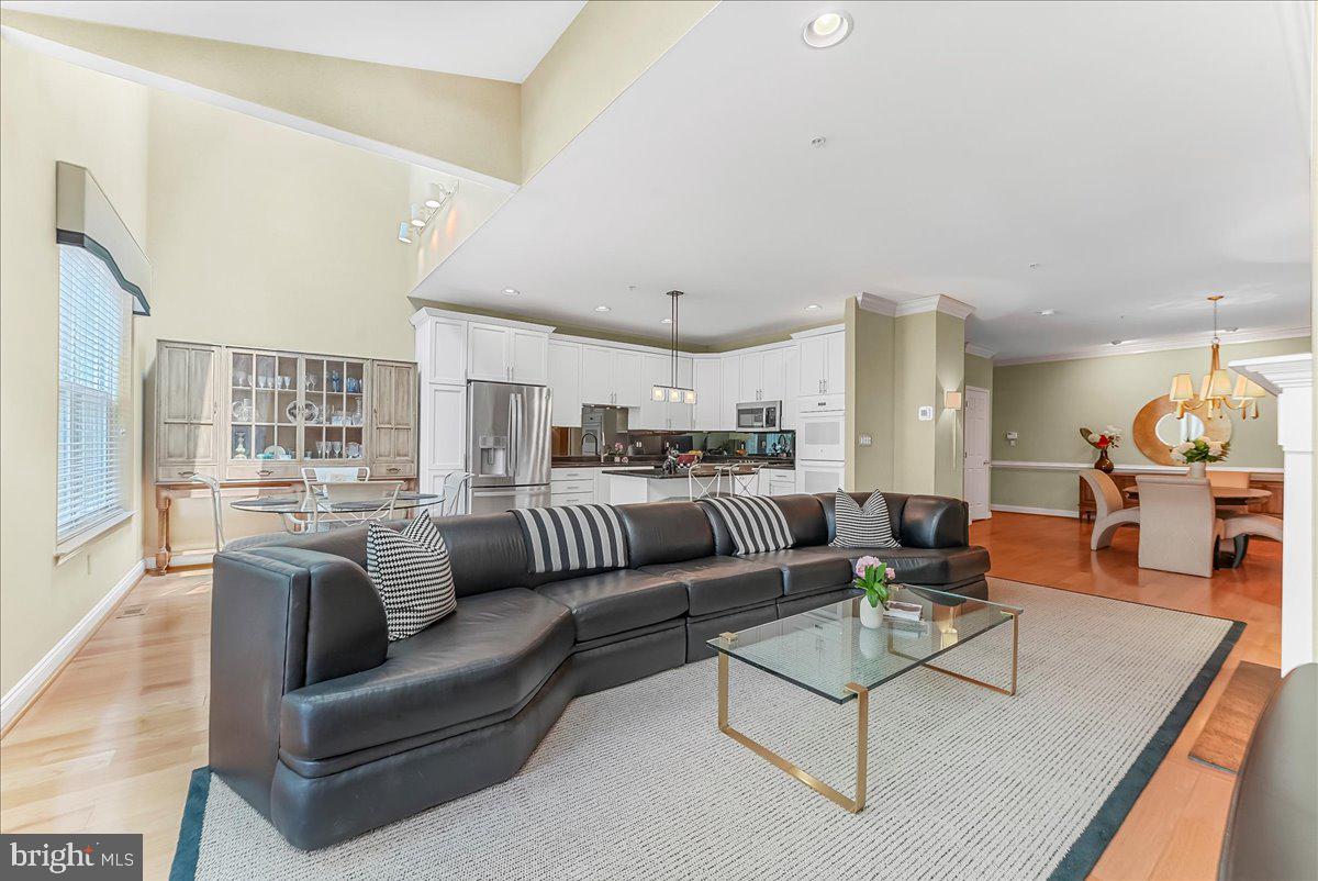 1132 Brian's Way Wayne, PA 19087 - Photo 7 of 45 a living room with furniture kitchen view and a large window