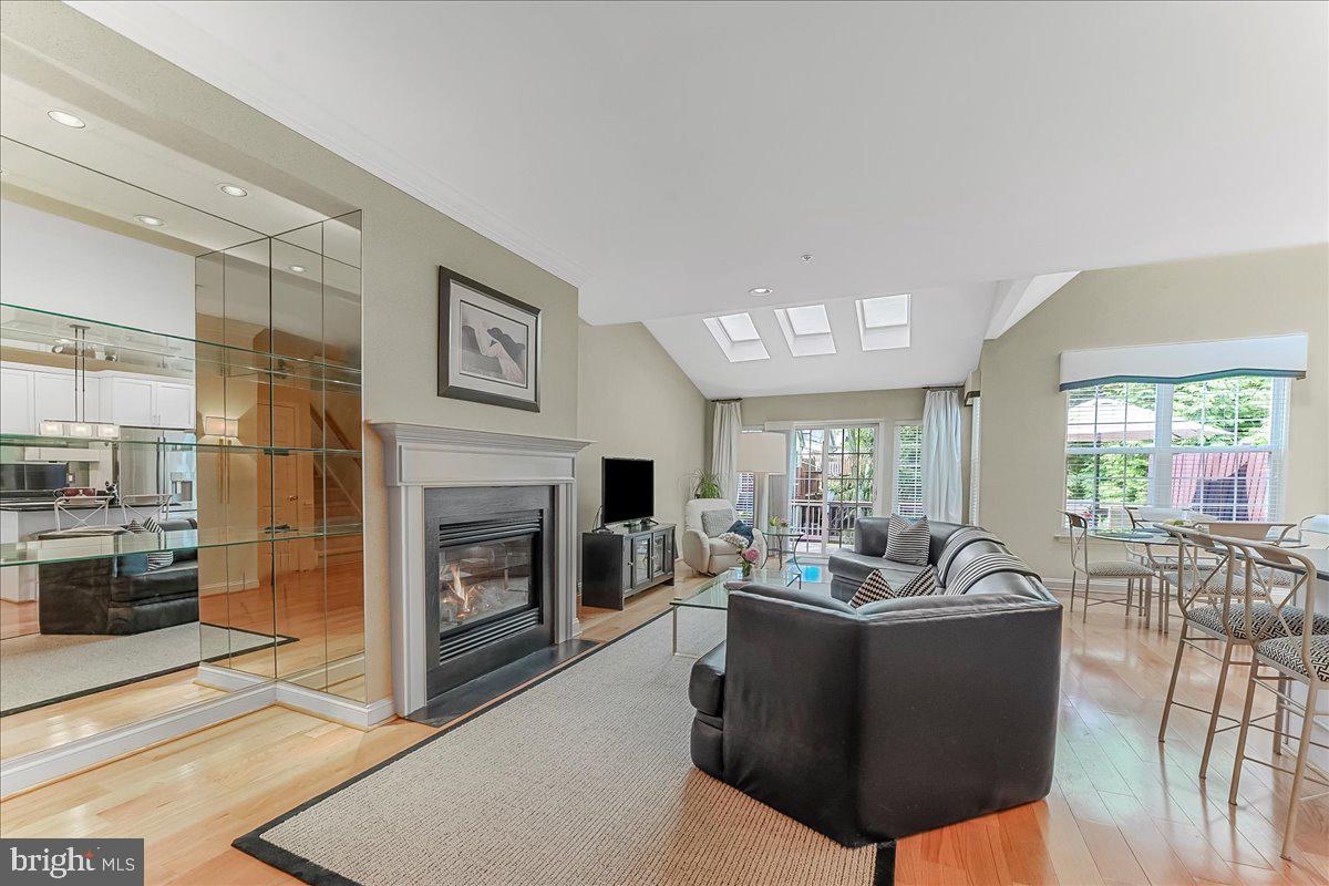 1132 Brian's Way Wayne, PA 19087 - Photo 10 of 45 a living room with furniture a fireplace and a large window