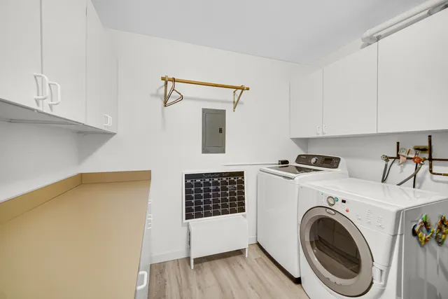 a view of storage and utility room with washer and dryer