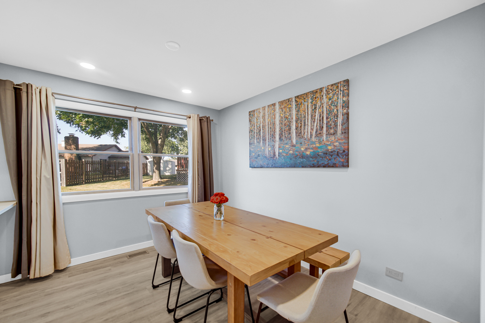 1028 West Park Pl Drive Bartlett, IL 60103 - Photo 4 of 24 a view of a dining room with furniture window and wooden floor