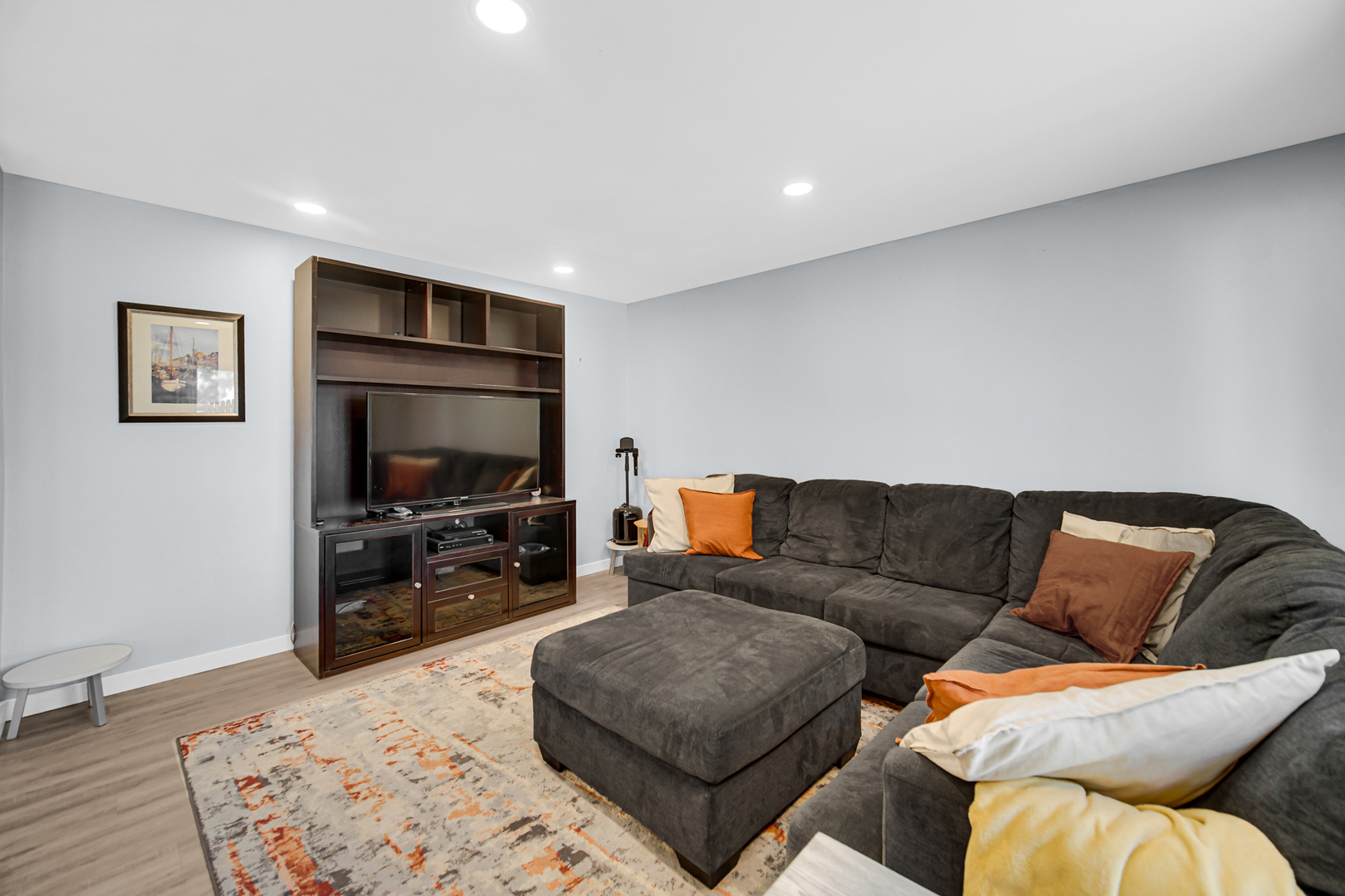 1028 West Park Pl Drive Bartlett, IL 60103 - Photo 9 of 24 a living room with furniture and a flat screen tv