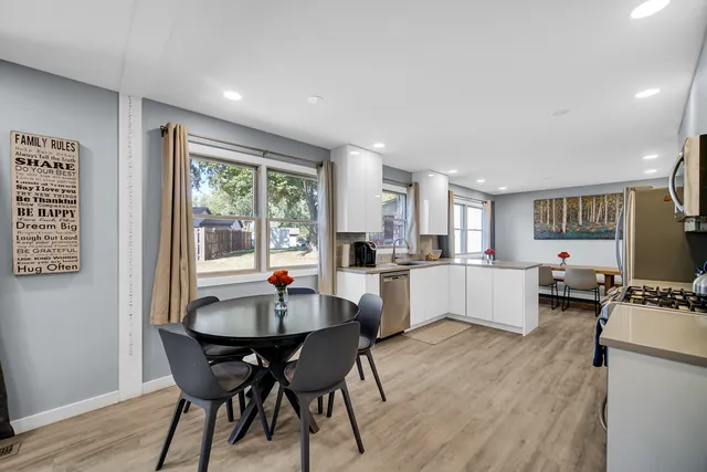 a dining room with furniture and window