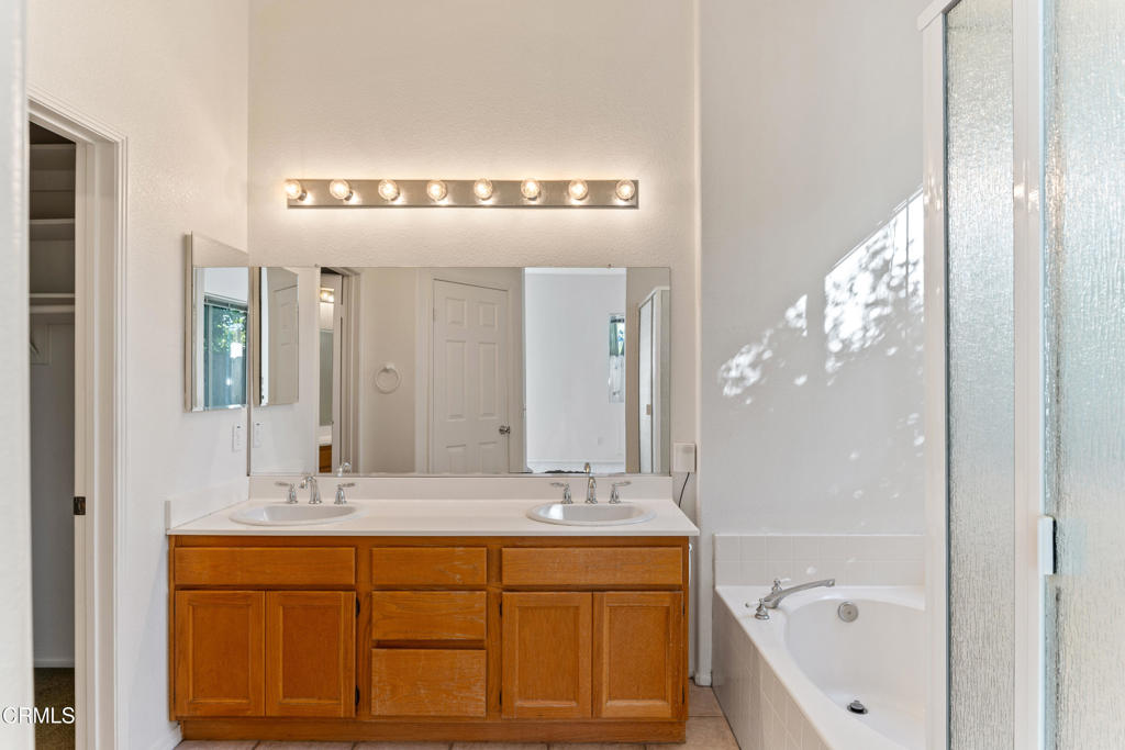 408 Grande Street Oxnard, CA 93036 - Photo 24 of 45 a bathroom with a double vanity sink mirror and bathtub