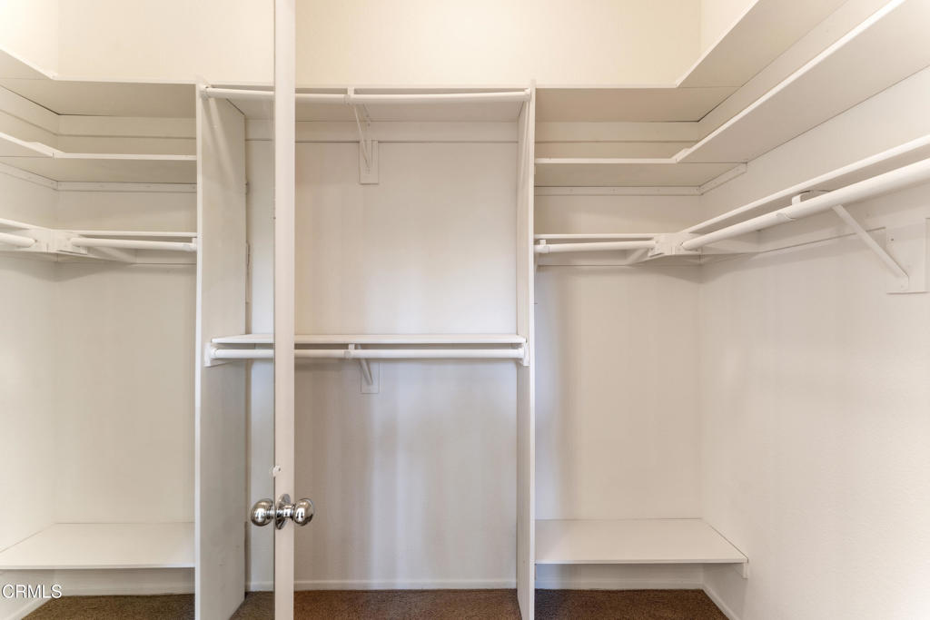 408 Grande Street Oxnard, CA 93036 - Photo 26 of 45 a view of walk in closet with empty racks