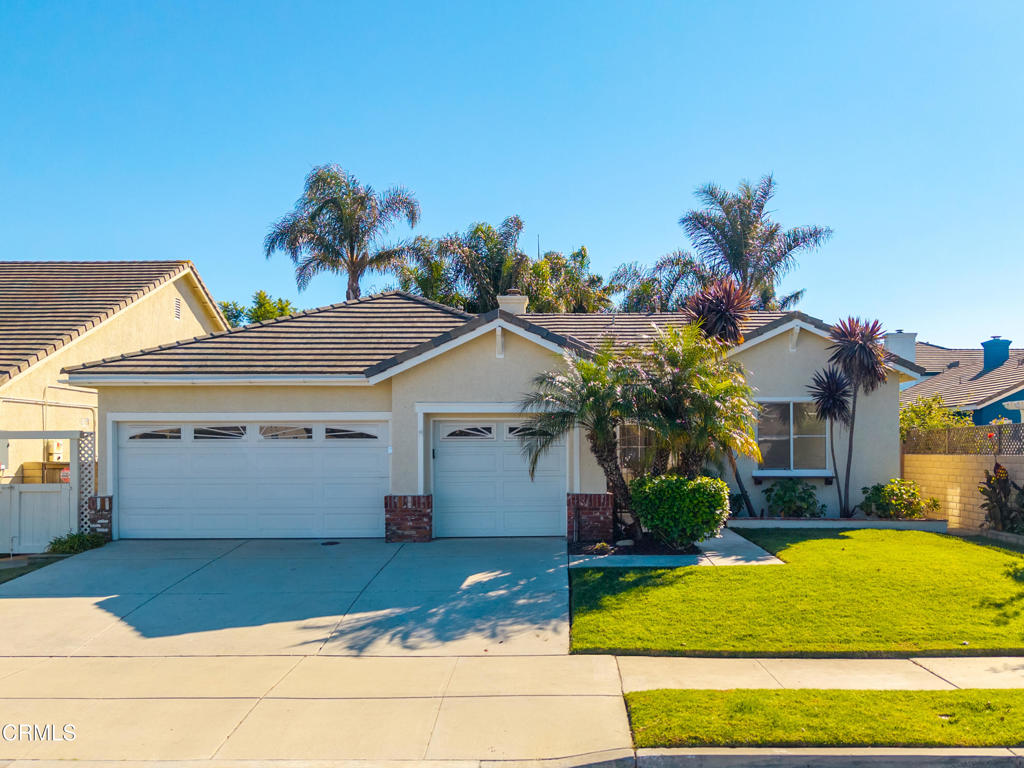 408 Grande Street Oxnard, CA 93036 - Photo 44 of 45 a front view of a house with a yard