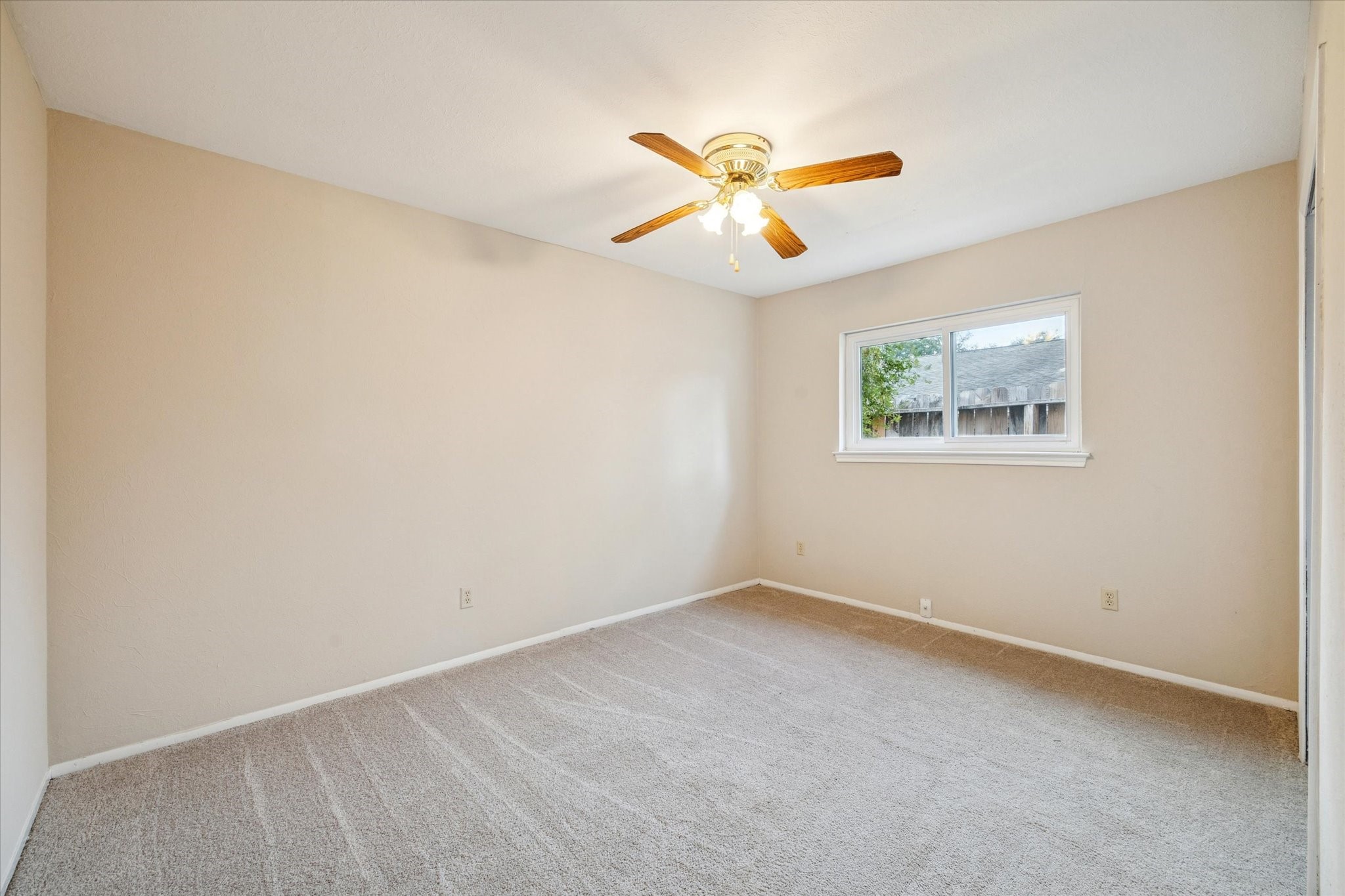 3902 Broken Elm Drive Spring, TX 77388 - Photo 12 of 19 an empty room with windows and fan