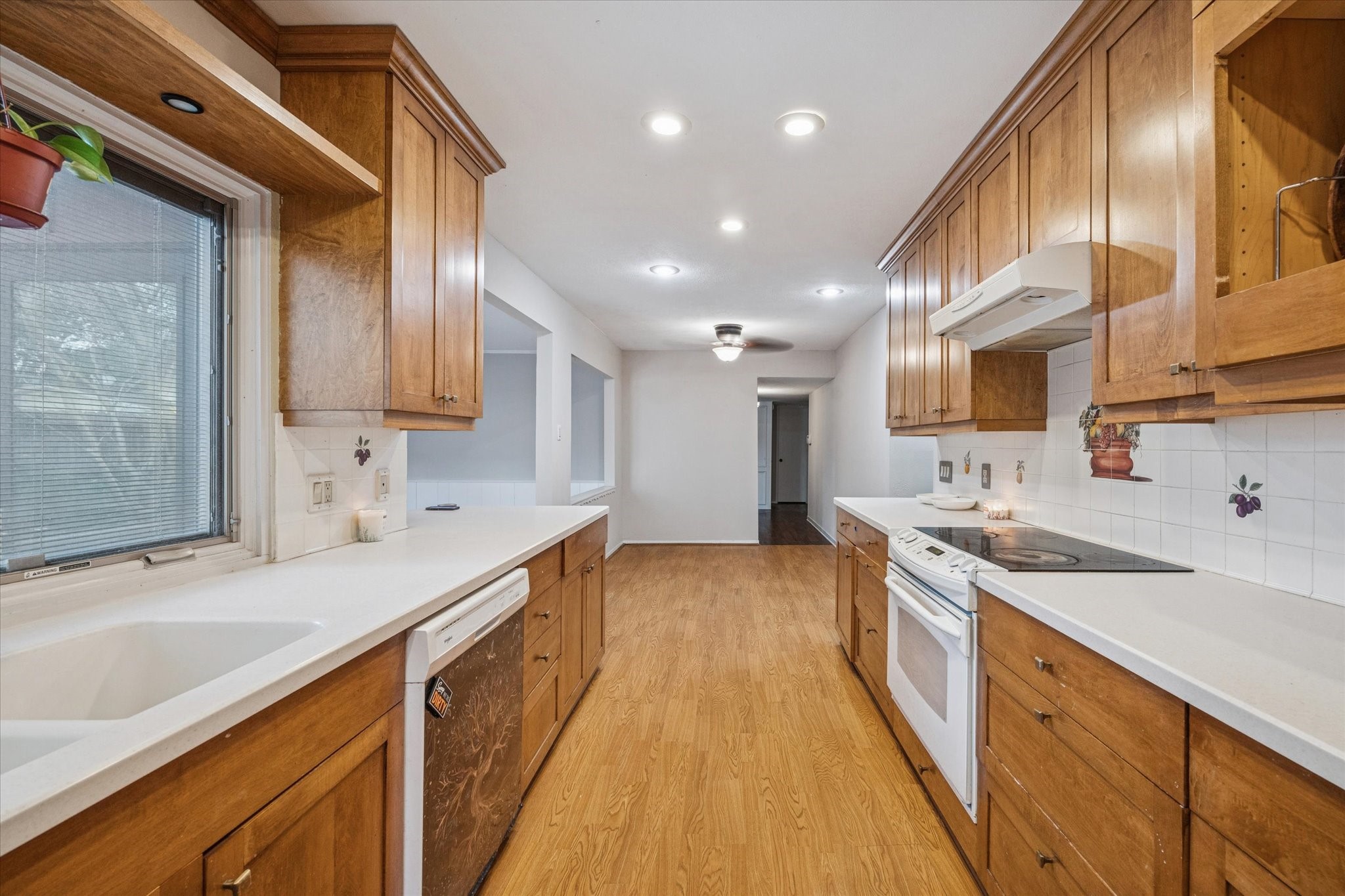 3902 Broken Elm Drive Spring, TX 77388 - Photo 7 of 19 a kitchen with stainless steel appliances sink stove and cabinets