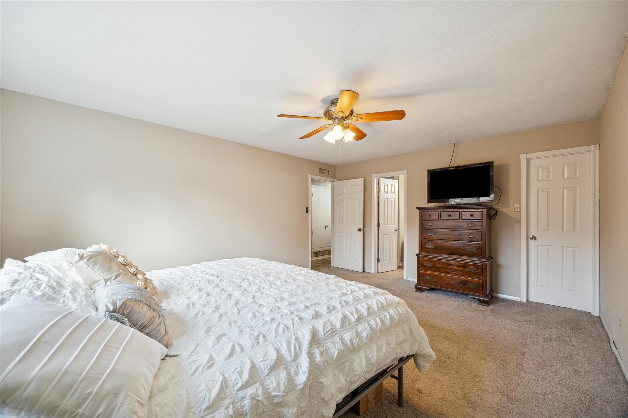3902 Broken Elm Drive Spring, TX 77388 - Photo 9 of 19 a bedroom with a bed and a flat screen tv