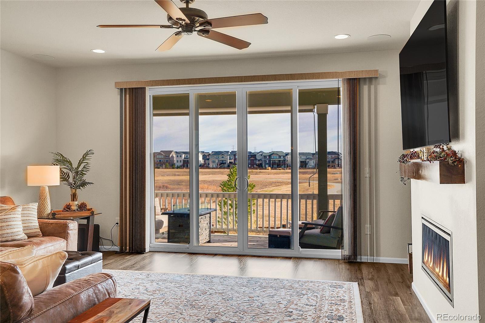815 Bear Peak Road Erie, CO 80516 - Photo 14 of 32 a living room with furniture and a window