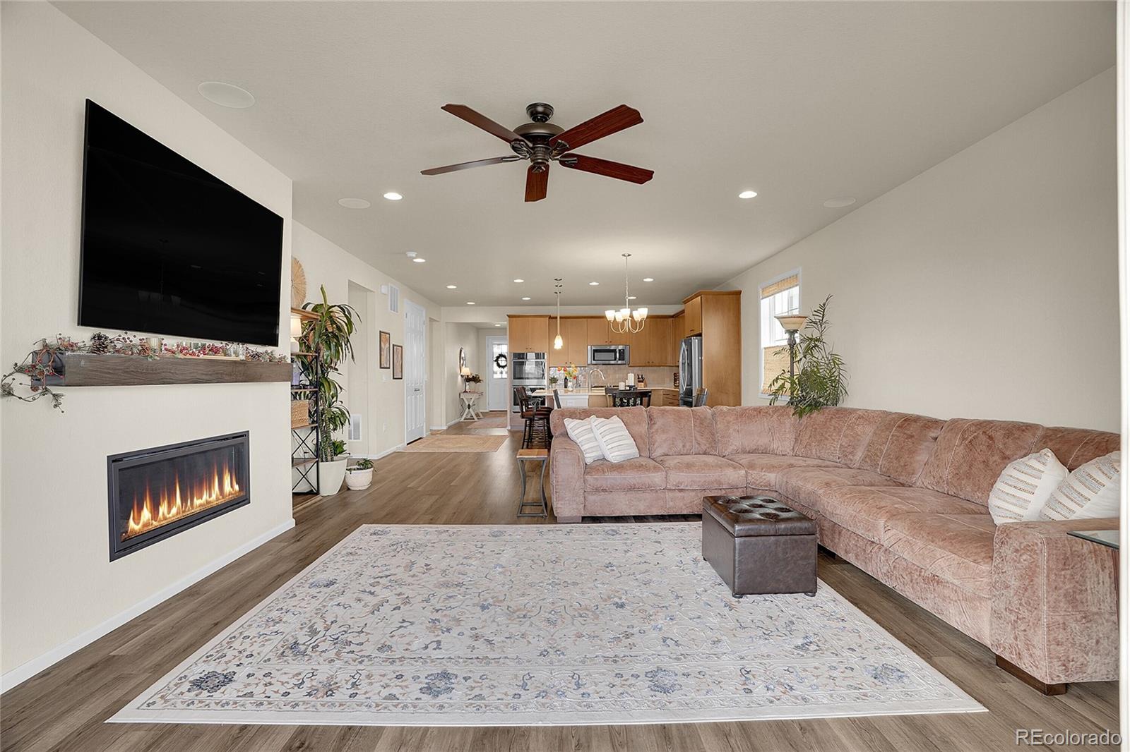 815 Bear Peak Road Erie, CO 80516 - Photo 15 of 32 a living room with furniture and a fireplace