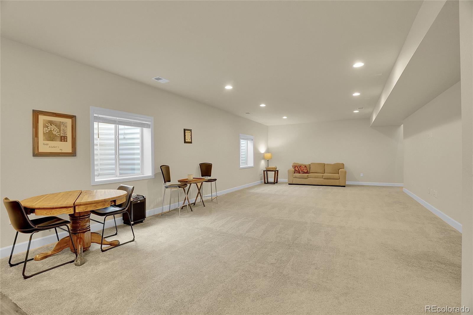 815 Bear Peak Road Erie, CO 80516 - Photo 22 of 32 a living room with furniture and a window