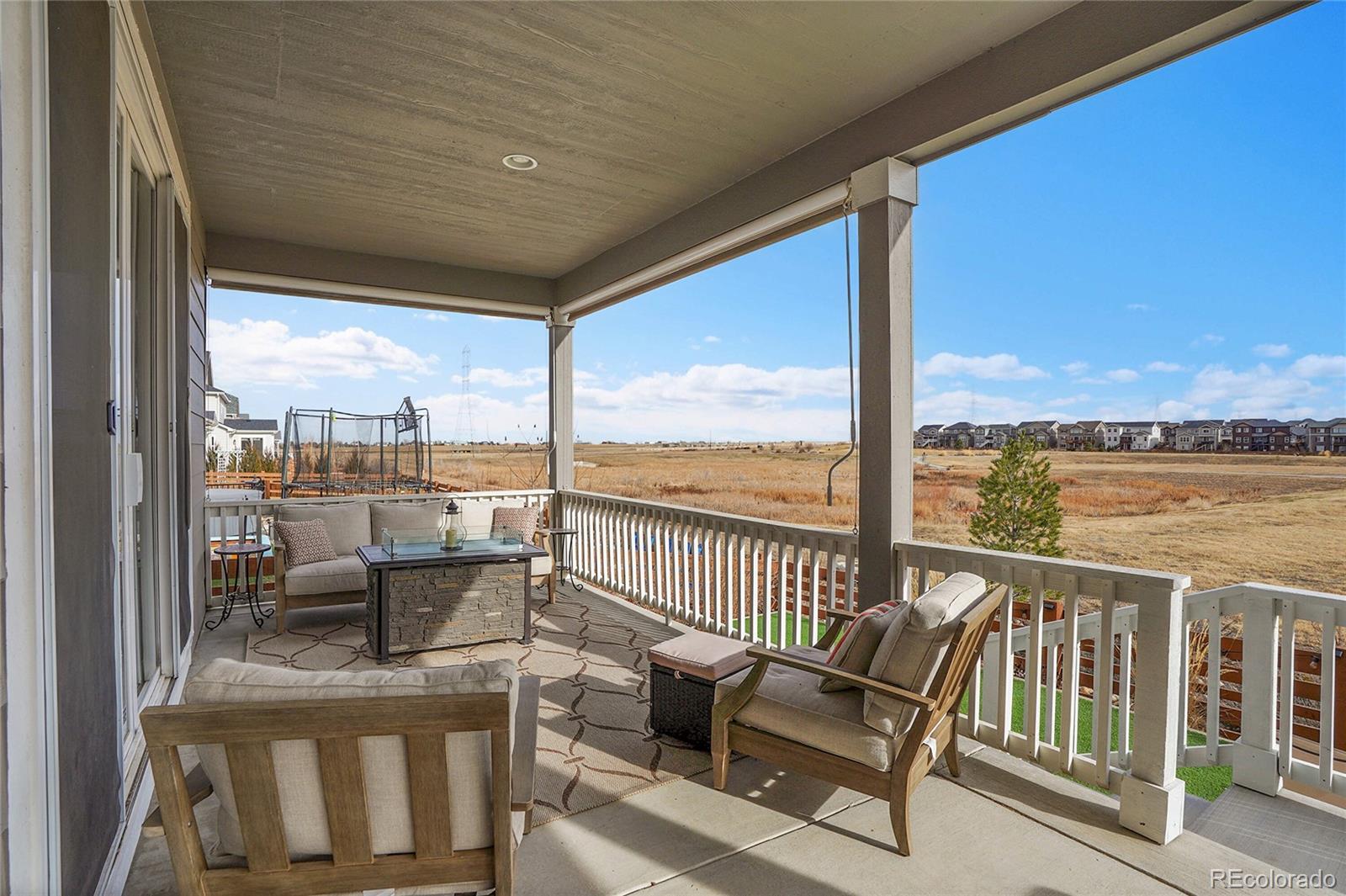 815 Bear Peak Road Erie, CO 80516 - Photo 28 of 32 a view of a chair and tables in the balcony
