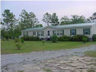 1440 Laird Road Crestview, FL 32539 - Photo 1 of 9 a front view of house with yard and green space