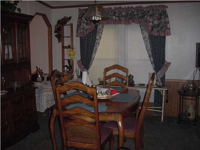 1440 Laird Road Crestview, FL 32539 - Photo 5 of 9 a view of a dining room with furniture and chandelier