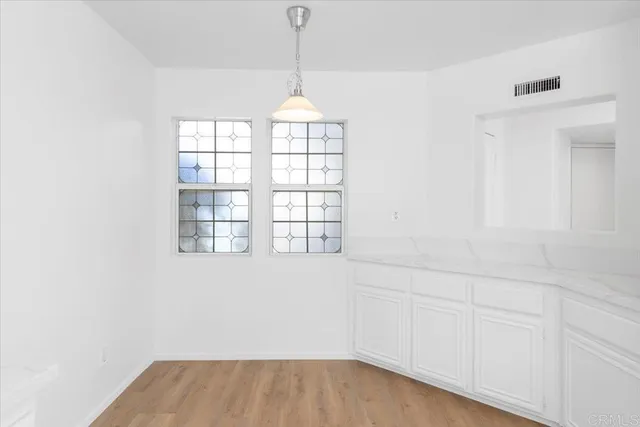 a view of an empty room with a window